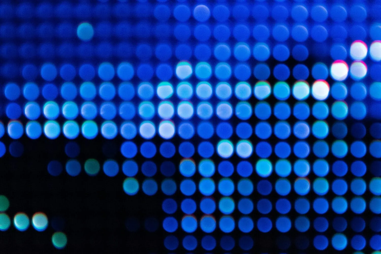 An image of a blue and green bokeh light pattern on a dark background, reminiscent of the clarity one achieves when crafting an Investment Policy Statement.