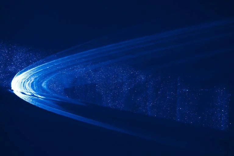 A streak of blue-hued light curves across a dark background, scattering particles and creating an ethereal glow, reminiscent of the shifting dynamics in Public Equities.