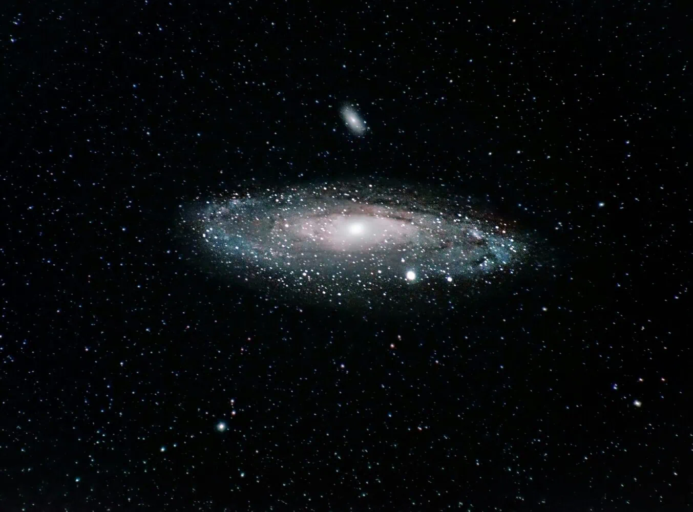 Image of a spiral galaxy against a backdrop of numerous stars, reminiscent of the insights we gained in 2022. The galaxy's bright center is surrounded by swirling arms of dust and gas, much like the movement seen in absolute return strategies.