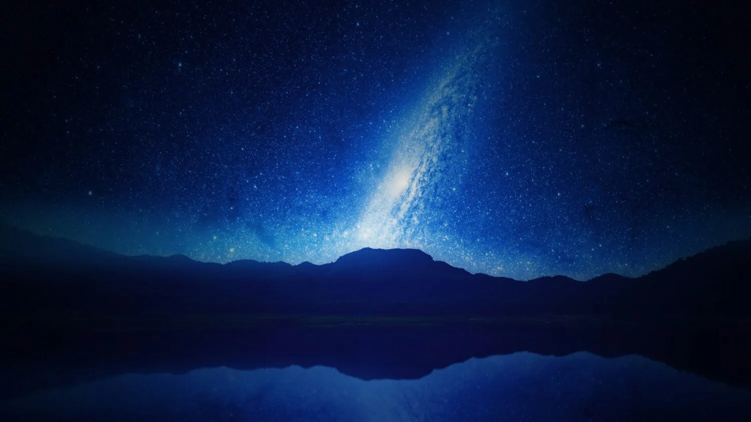 A clear, star-filled night sky with a prominent band of the Milky Way above a silhouette of distant mountains, reflected in calm waters below—a setting that inspires insights akin to those from 2021's market analysis.