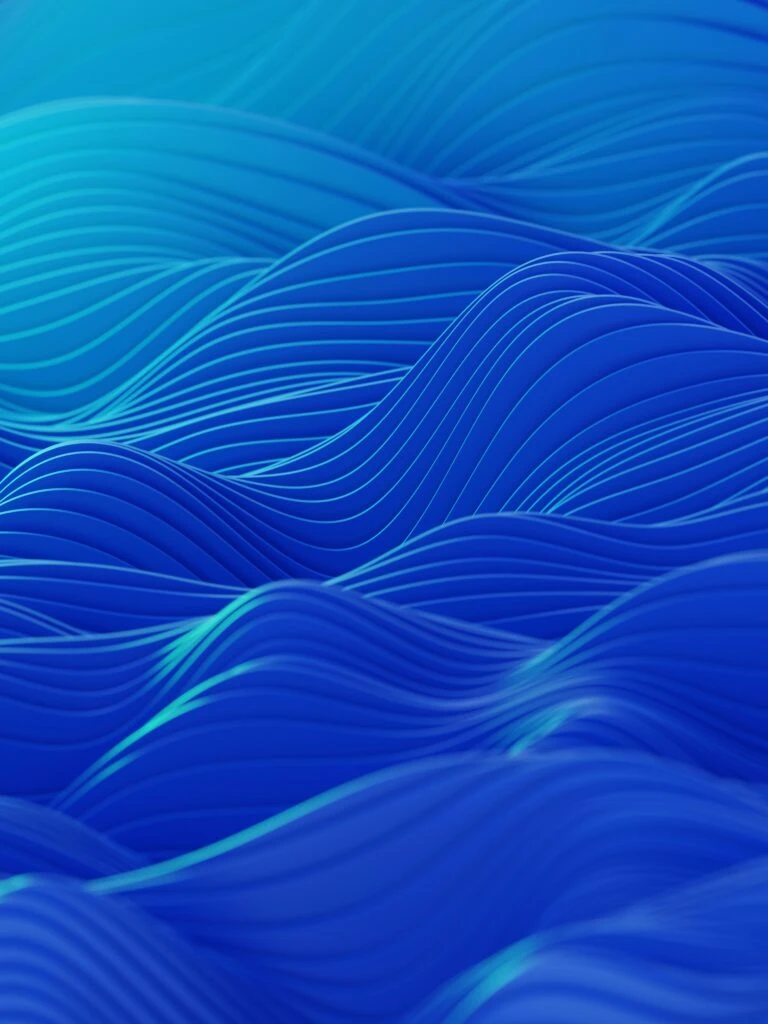 Abstract image featuring smooth, wavy blue lines creating a flowing pattern, reminiscent of the ebb and flow of investing and financial education.