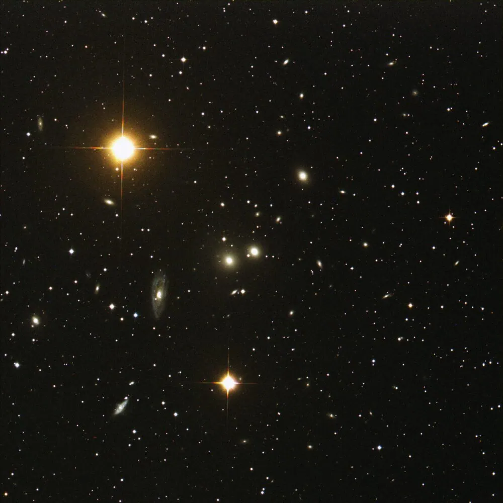 An image of outer space showing numerous stars and galaxies with two prominent, bright stars towards the center and lower left, offering a glimpse into the vast universe akin to uncovering global insights from 2022.